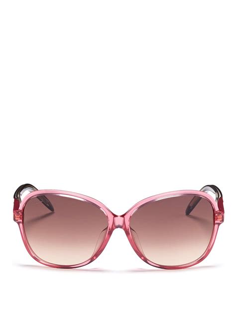 pink oversized gucci sunglasses.